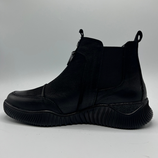 Black ankle boot on a light gray background
