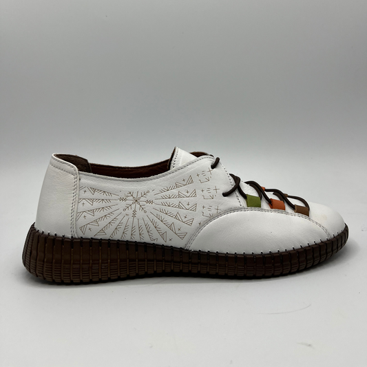 Right facing view of a white leather shoe with a light brown, very detailed design on the side. With elasticated laces and a brown outsole.