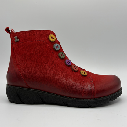 Right facing view of a red short boot with colourful buttons, a black outsole and a pull on heel tab