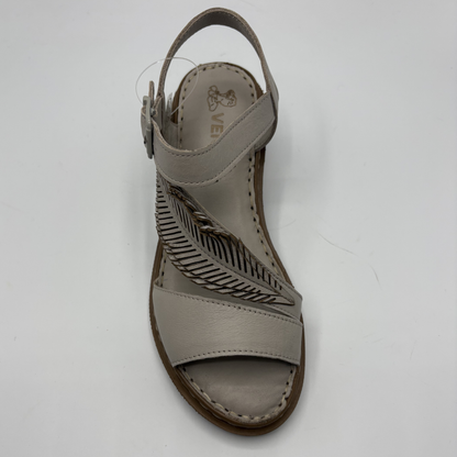 Taupe sandal with cut-out design on a white background