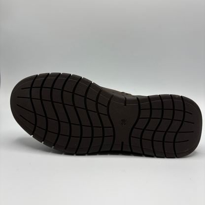 Bottom view of a brown leather chelsea boot with an elastic side gore and inside zipper