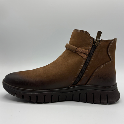Left facing view of a brown leather chelsea boot with an elastic side gore and inside zipper