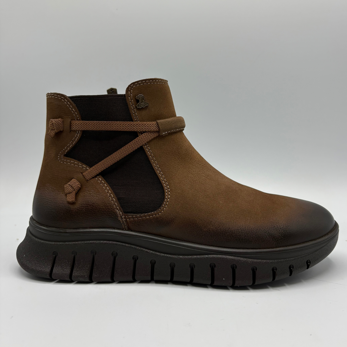 Right facing view of a brown leather chelsea boot with an elastic side gore and inside zipper
