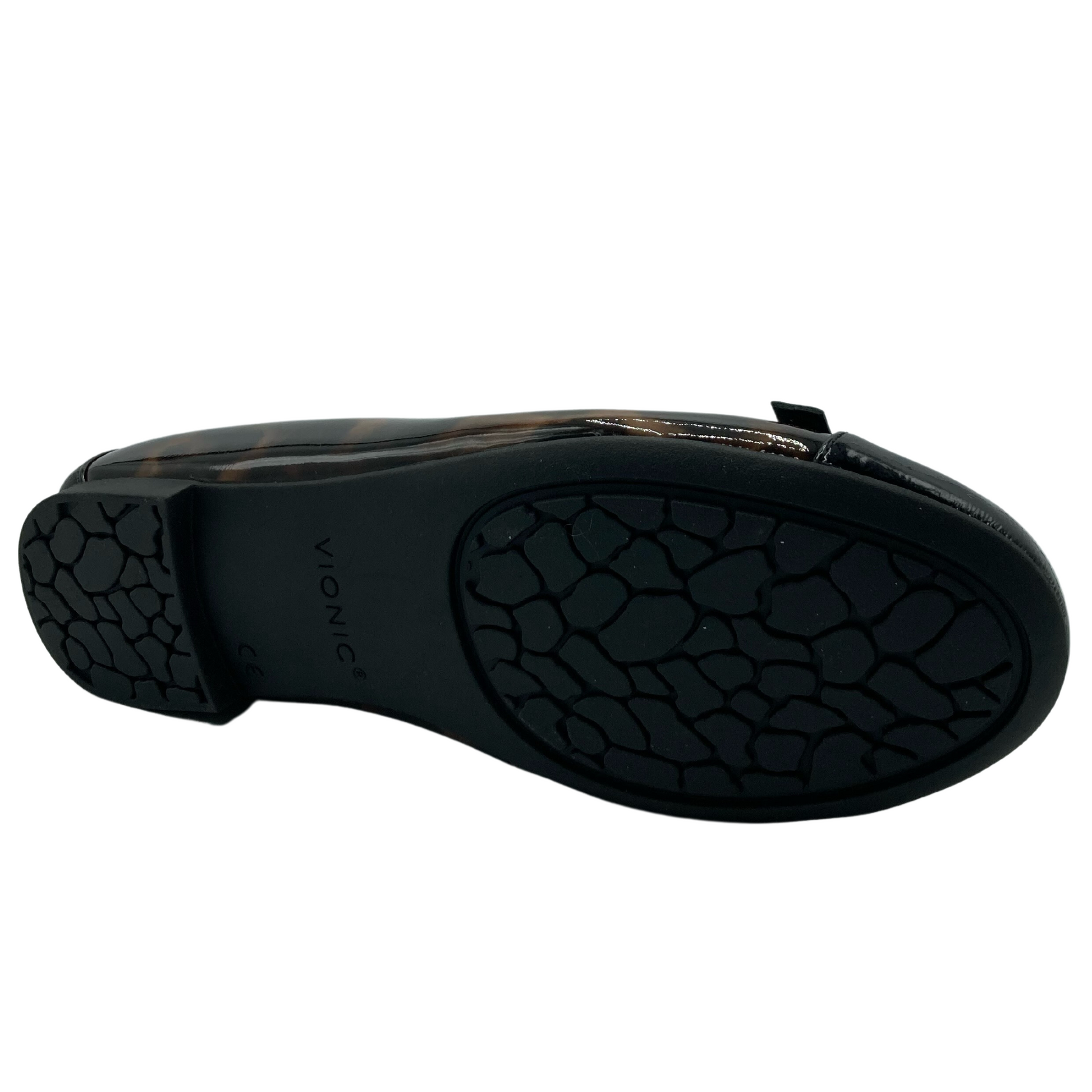 Bottom view of black and leopard print ballet flat with black rubber sole