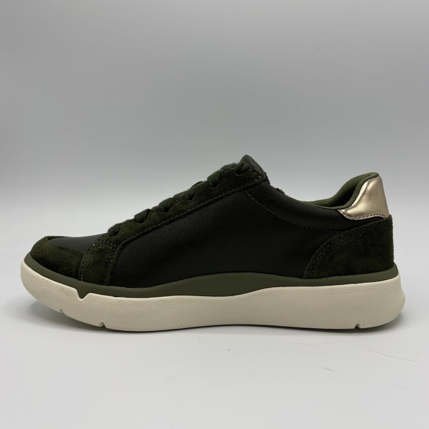 Left view of an Olive coloured sneaker with a side zipper