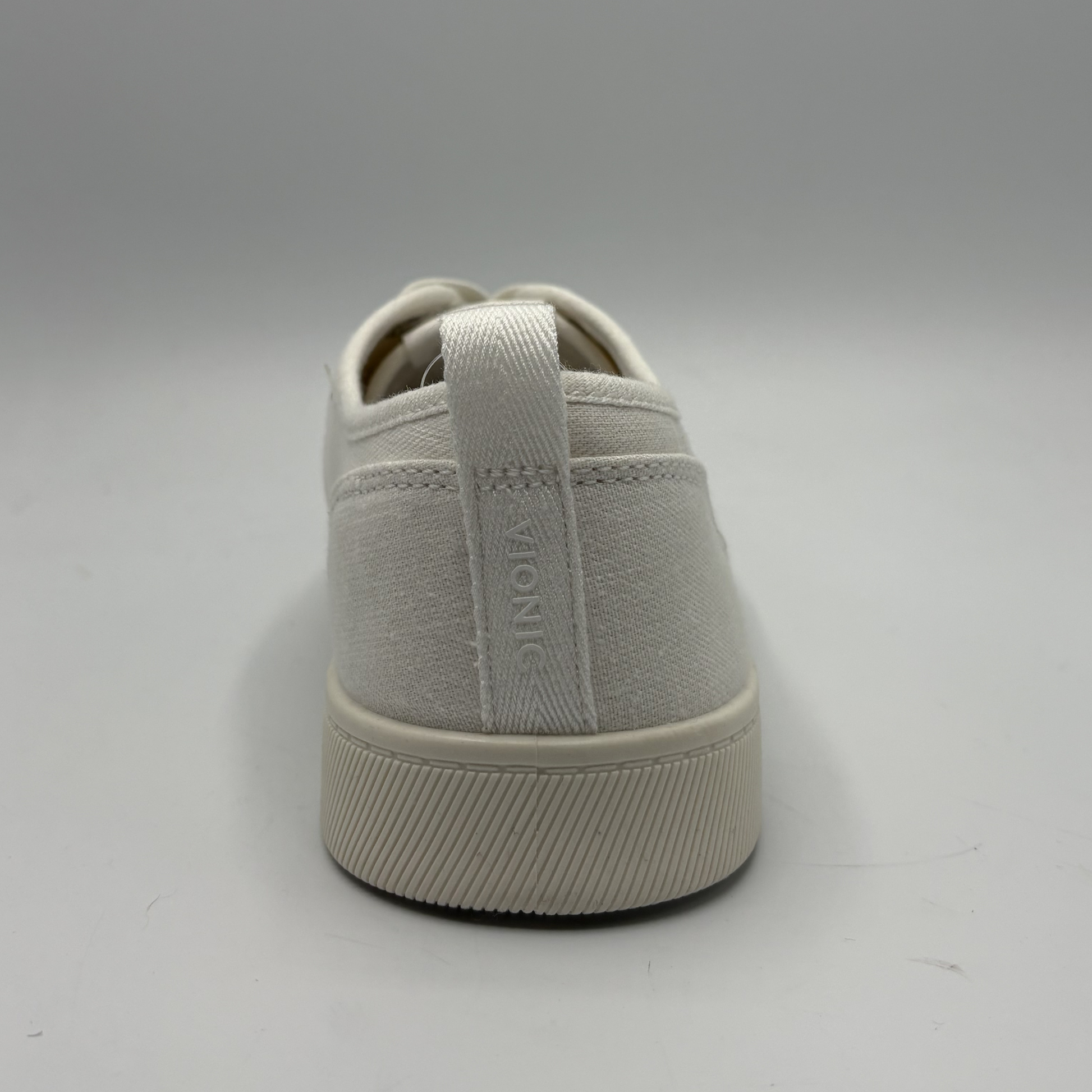 Light gray sneaker with 'Vionic' branding on a white background