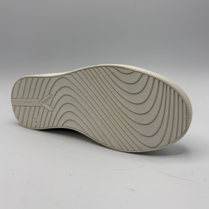 Sole of a shoe with tread pattern on a gray background