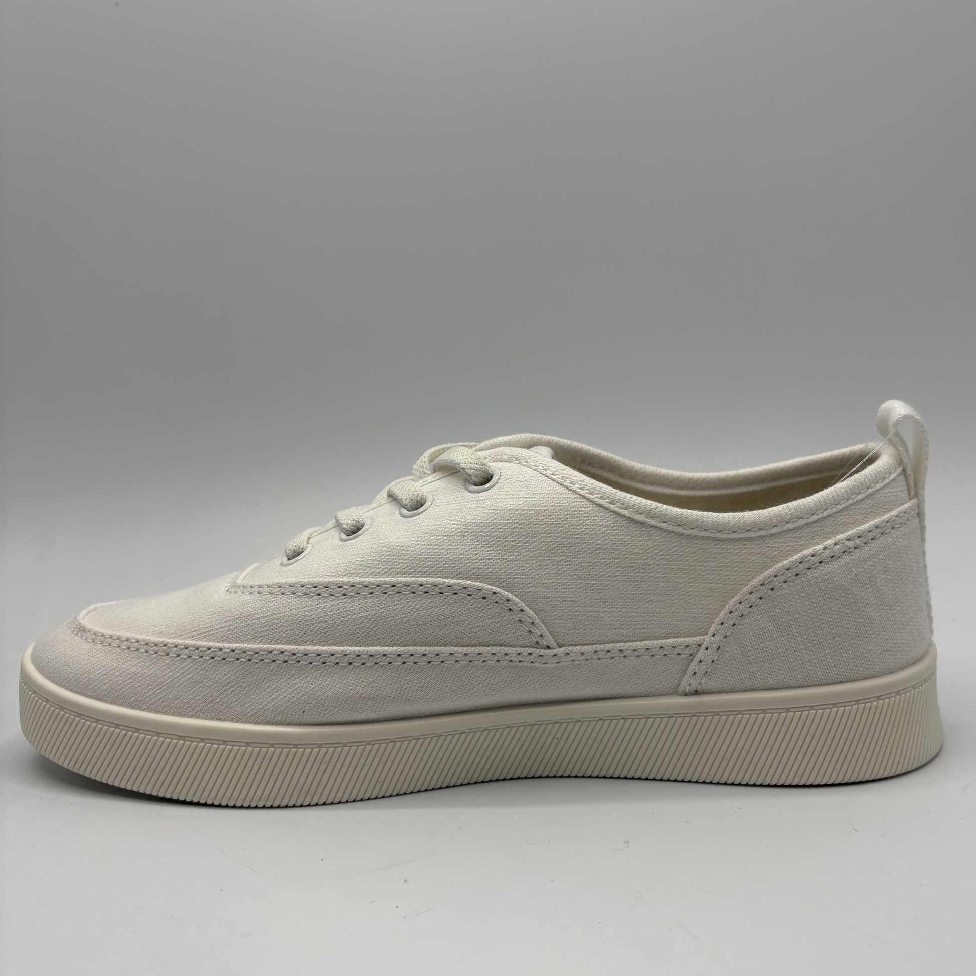 White sneaker on a gray background