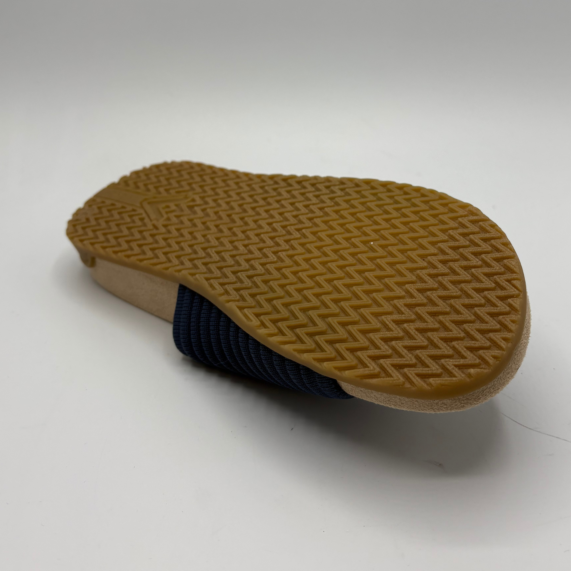 Brown sole of a shoe on a white background
