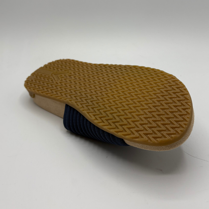 Brown sole of a shoe on a white background