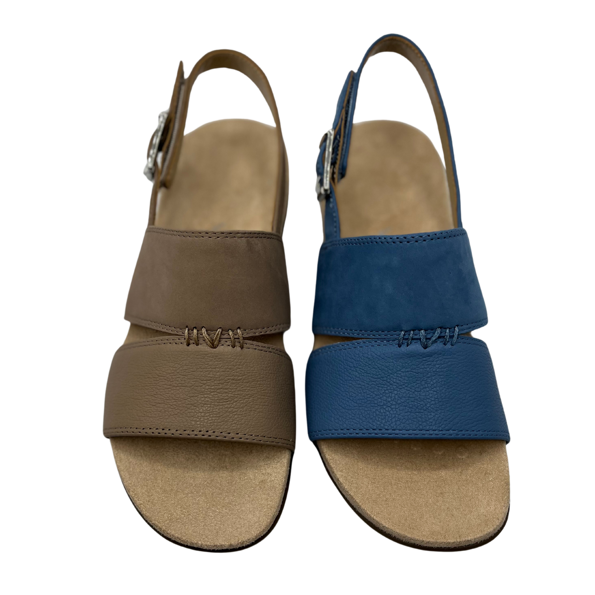 Top down view of one brown leather sandal beside one blue leather sandal. Both have a slingback strap with silver buckle