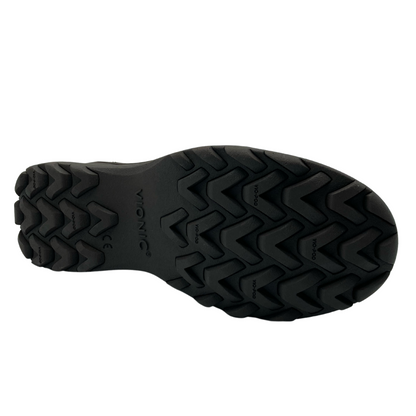 View of the bottom of a nubuck short bootie with black rubber sole and tread