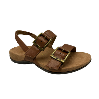 45 degree angled view of brown leather sandals with gold buckles, sling back strap and microfibre wrapped footbed.