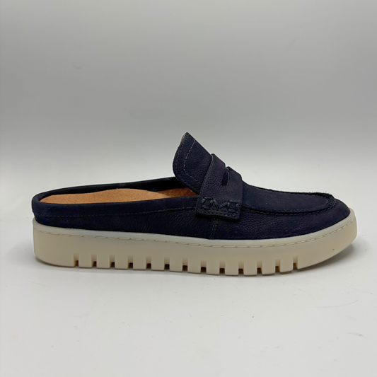 Right facing view of a navy slip on mule