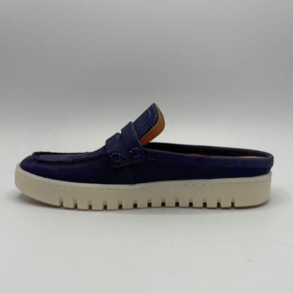 Left facing view of a navy slip on mule