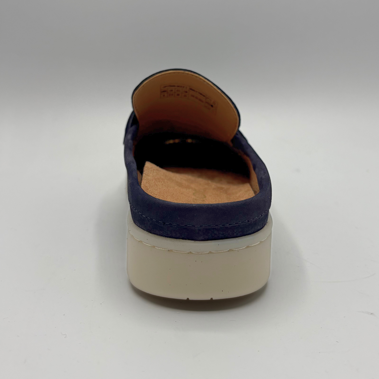 Back view of a navy slip on mule