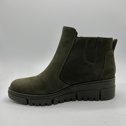 Green ankle boot on a white background