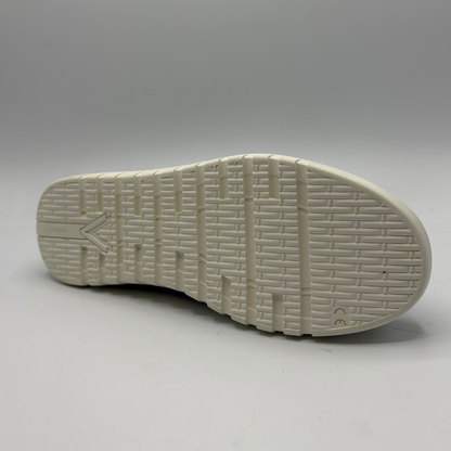 White sole of a shoe on a gray background