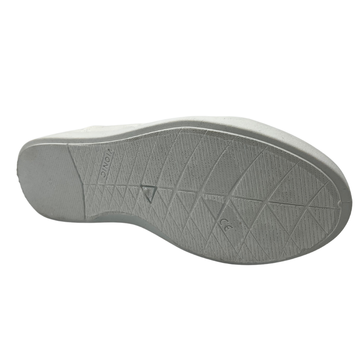 Bottom view of white canvas shoe with white rubber outsole and white laces