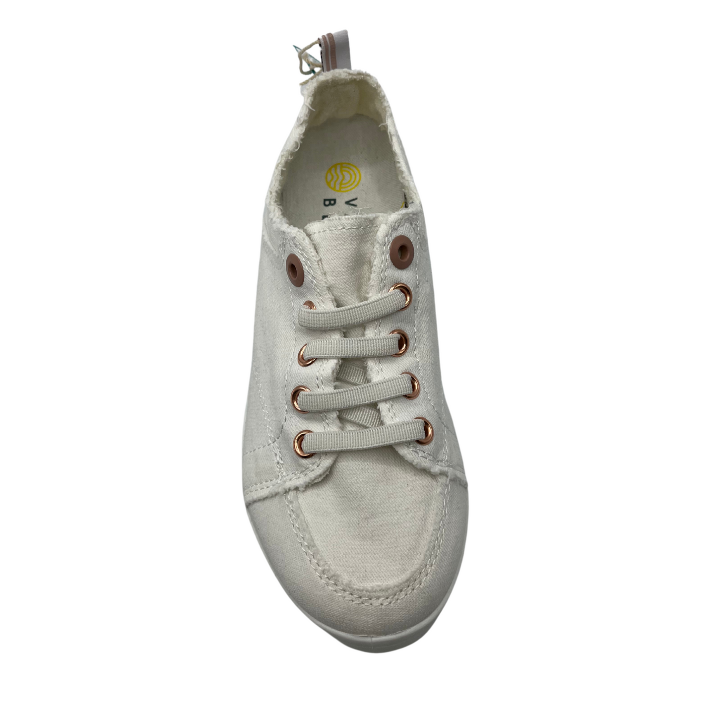 Top view of white canvas shoe with white rubber outsole and white laces
