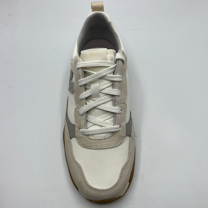 White and gray sneaker on a light gray background