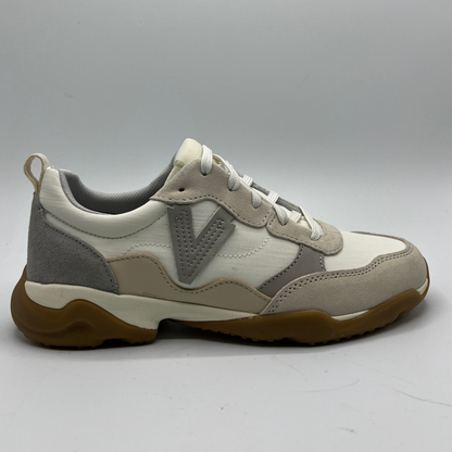 Beige and gray sneaker with brown sole on a white background