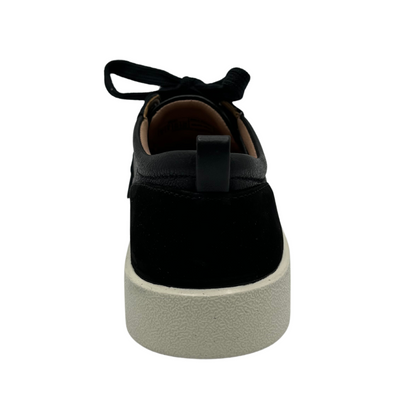 Back view of black nubuck leather and suede sneaker with matching laces and white rubber outsole