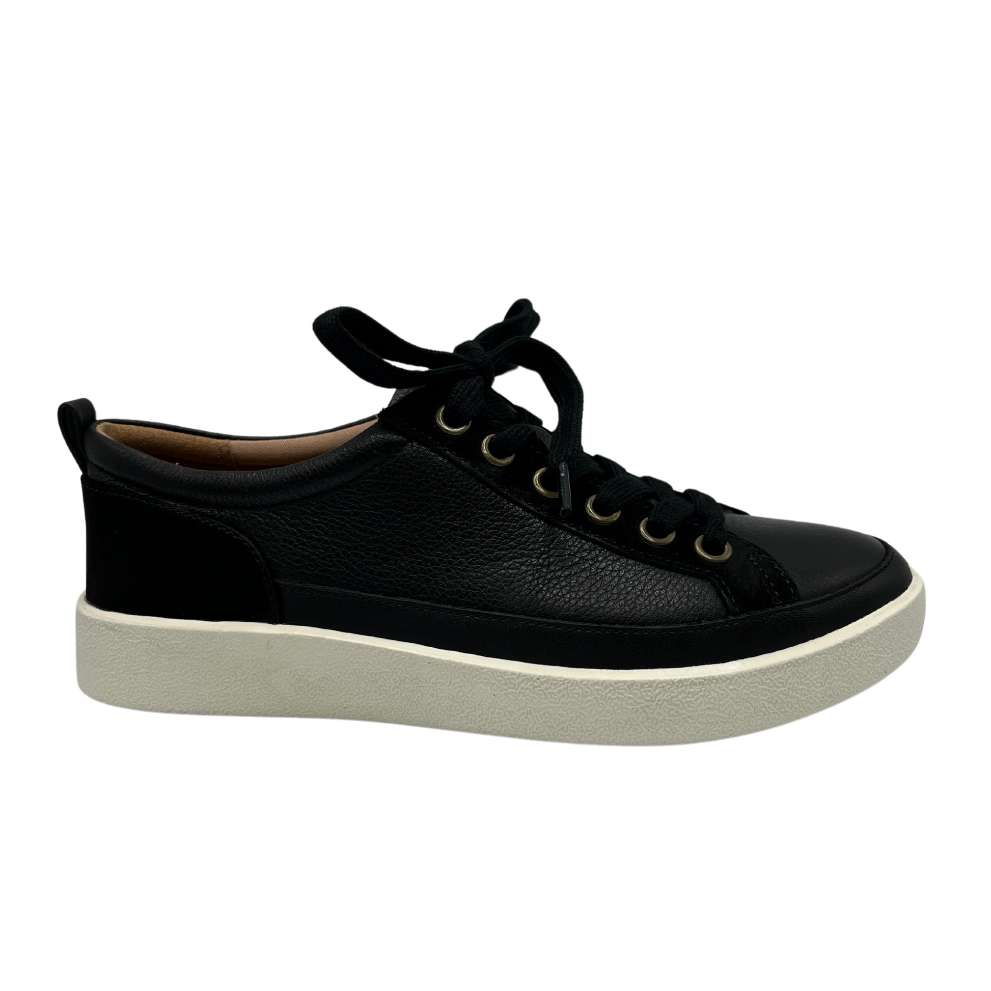 Right facing view of black nubuck leather and suede sneaker with matching laces and white rubber outsole