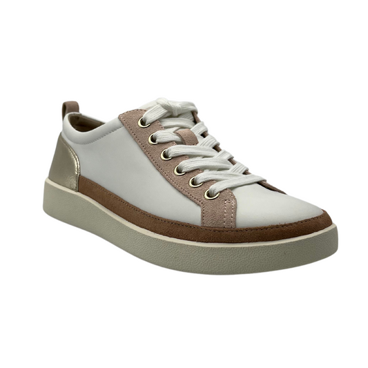 45 degree angled view of white leather sneaker with gold and brown leather details