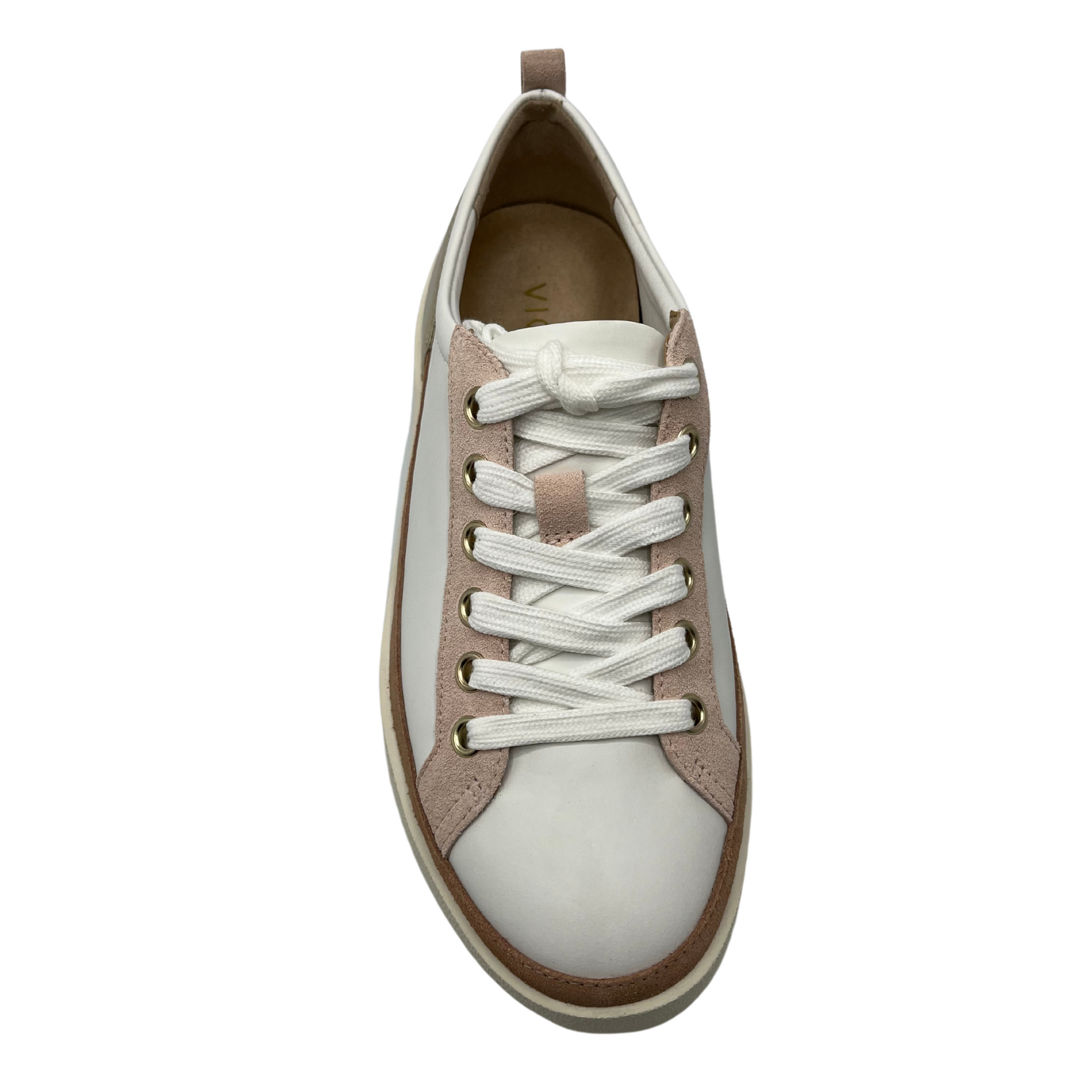 Top view of white leather sneaker with rounded toe and white rubber outsole