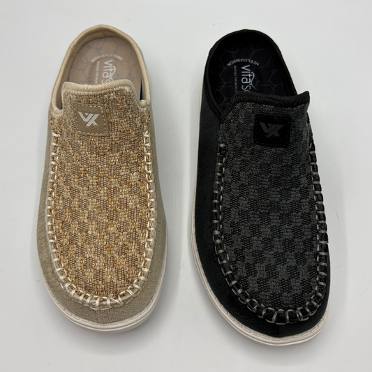 Top view of two slip on shoes. One is beige and the other is black