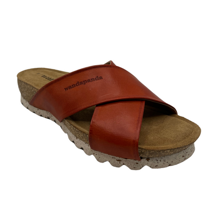45 degree angled view of sandal with red leather straps and rounded toe