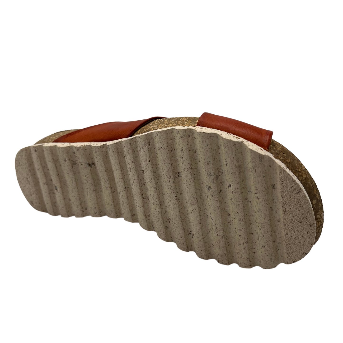 Bottom view of sandal with red leather straps and cork footbed