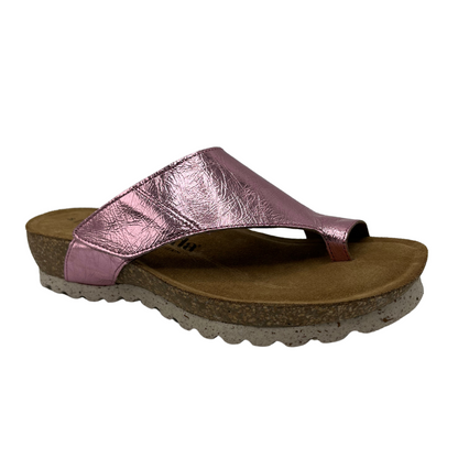 45 degree angled view of pink leather sandal with cork footbed and velcro adjustment strap