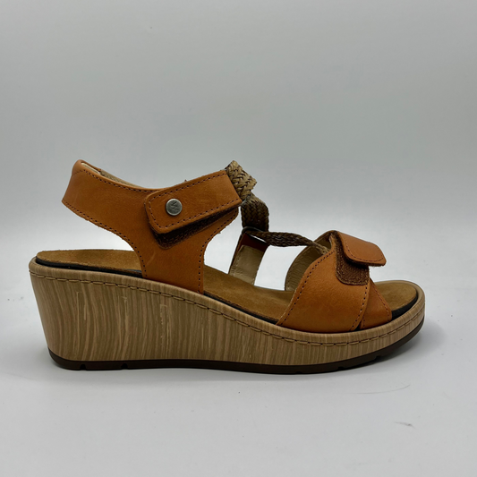 Right facing view of a brown leather sandal with adjustable straps, a contoured footbed and a wedge heel.