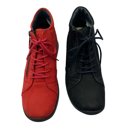 Top view of one red shoe and one black shoe. Both have laces, rounded toes and side zipper closures