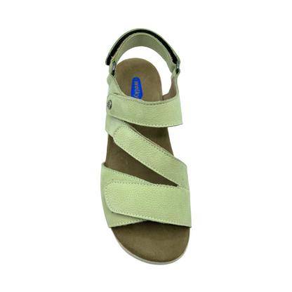 Top down view of a light green leather sandal.  Four adjustable velcro tabs to create a custom fit.  Velcro at front strap, over midstep, top strap and ankle strap