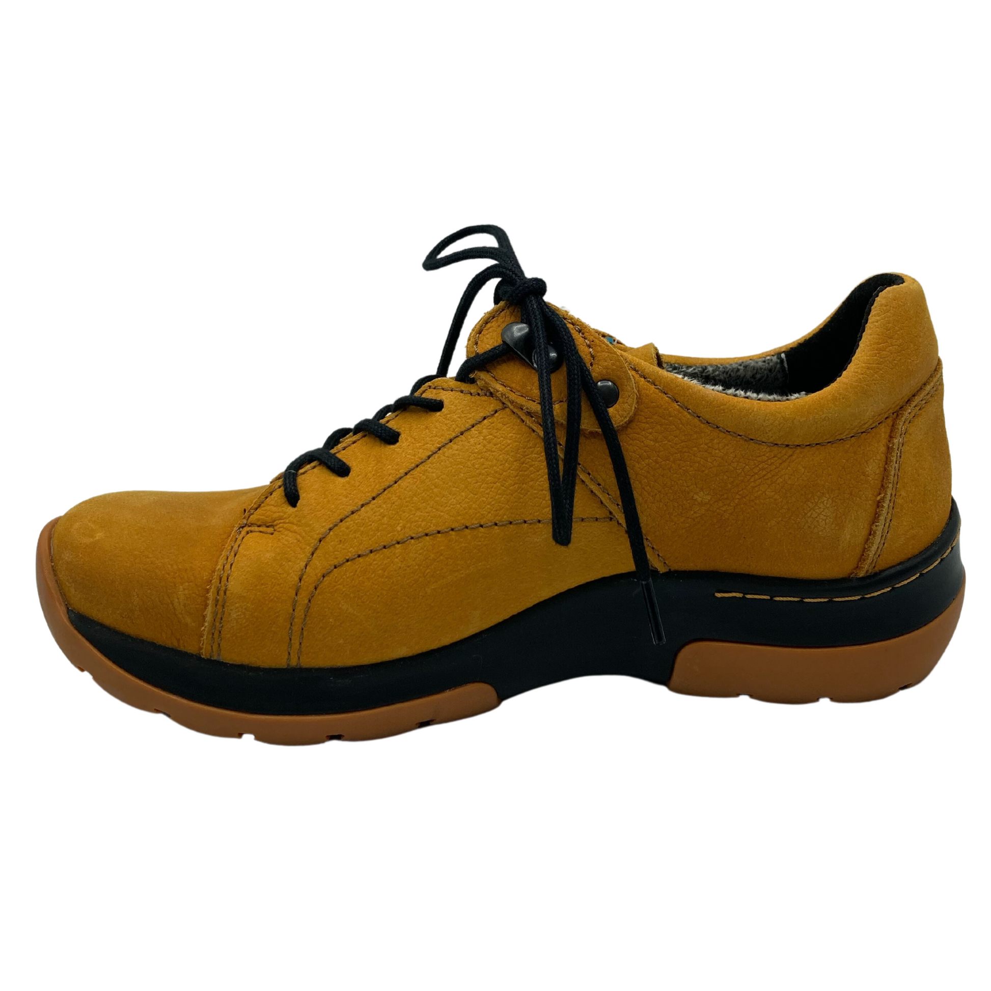 Left facing view of yellow nubuck sneaker with thick rubber sole and black laces