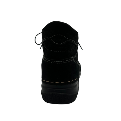 Back view of black suede ankle boot with black rubber outsole
