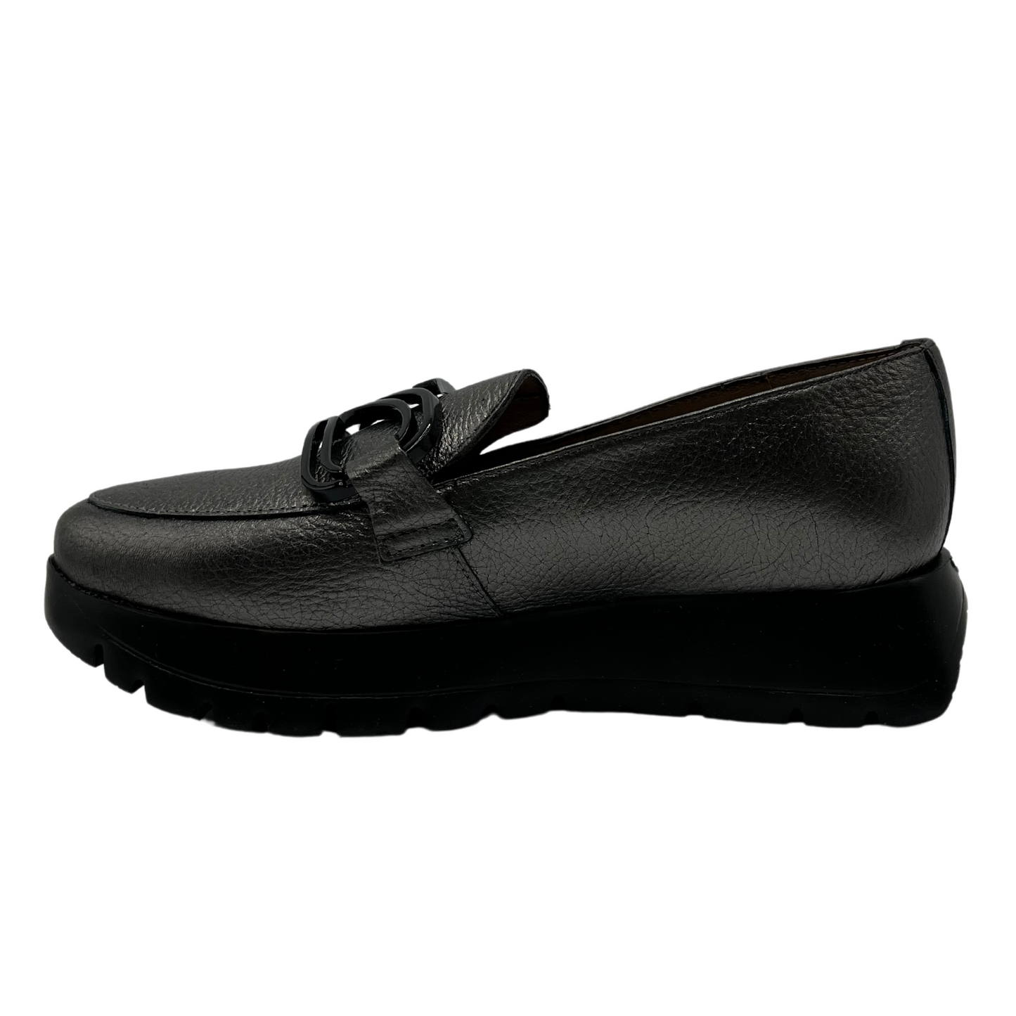 Left facing view of textured leather loafer in grey. A black thick platform sole and black embellishment on the upper 