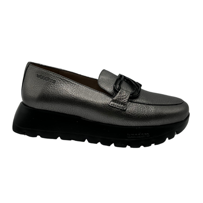 Right facing view of textured leather loafer in grey. A black thick platform sole and black embellishment on the upper 