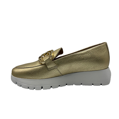 Left facing view of gold leather loafers with lightweight white platform sole and gold detail on upper.