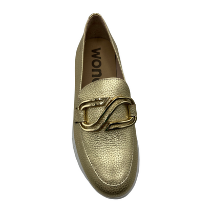 Top view of gold leather loafers with lightweight white platform sole and gold detail on upper.