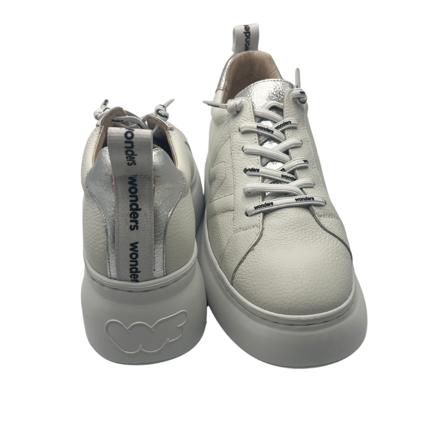 View of a pair of leather sneakers with heel pull tab and white platform sole