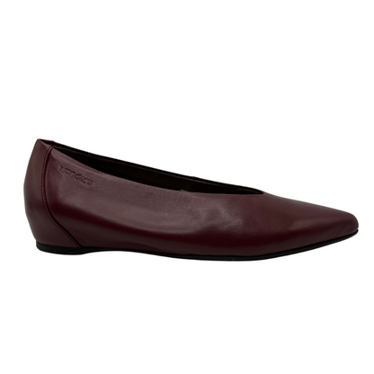 Right facing view of wine coloured shoe with wedge heel and pointed toe