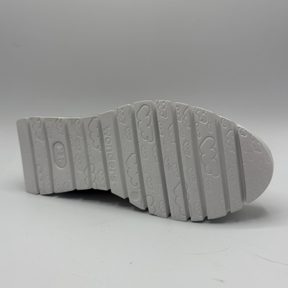 Gray shoe sole with tread pattern on a gray background