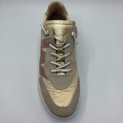Beige sneaker with gold accents on a white background