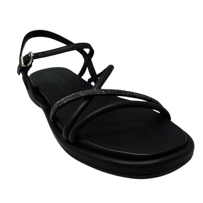 45 degree angled view of black leather sandal with padded sole, rhinestone detail and square toe