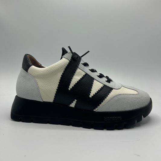 Sneaker with black and white pattern on a gray background