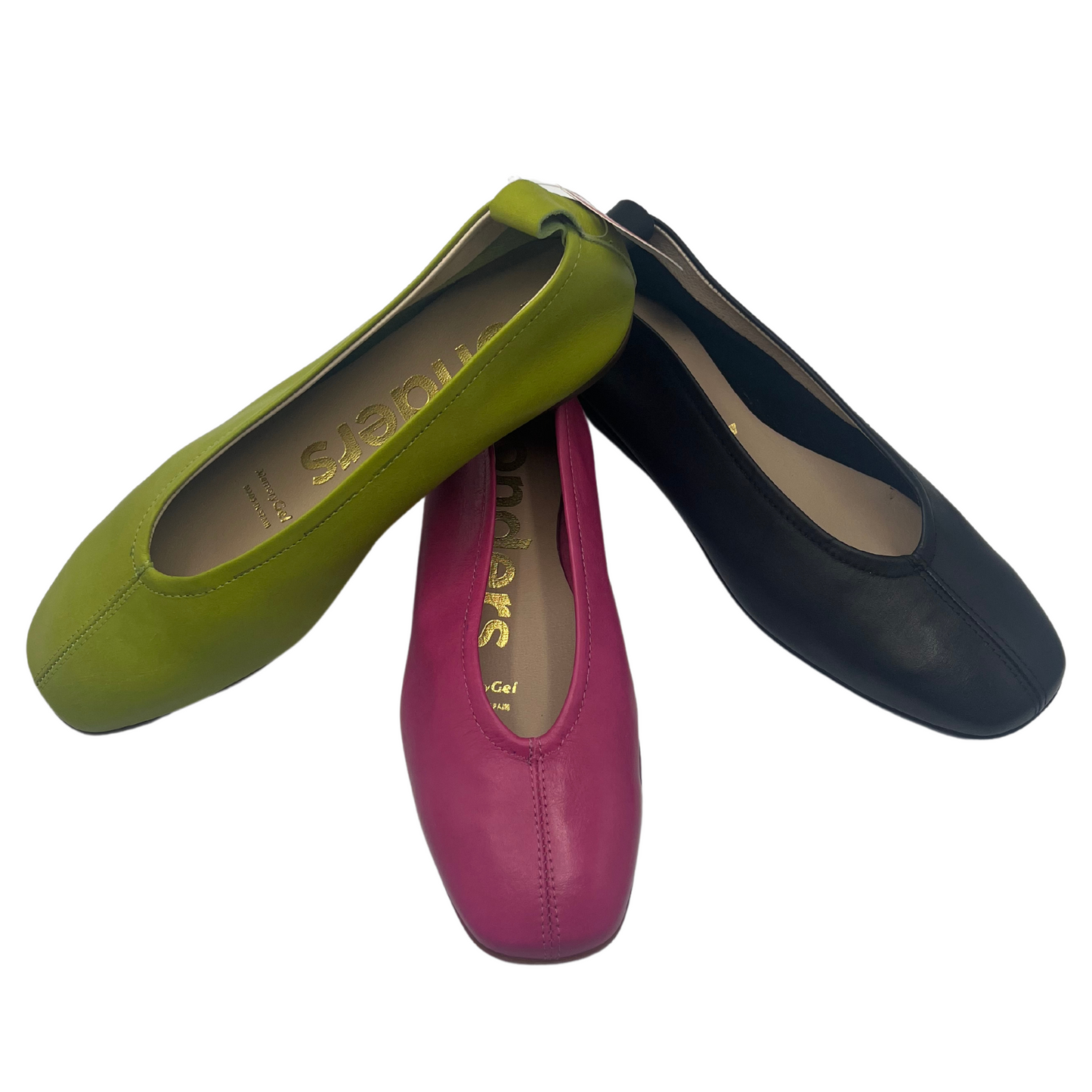 Top view of three ballet flats piled on top of each other. Apple green. orchid pink and black. All have leather upper and rubber outsole